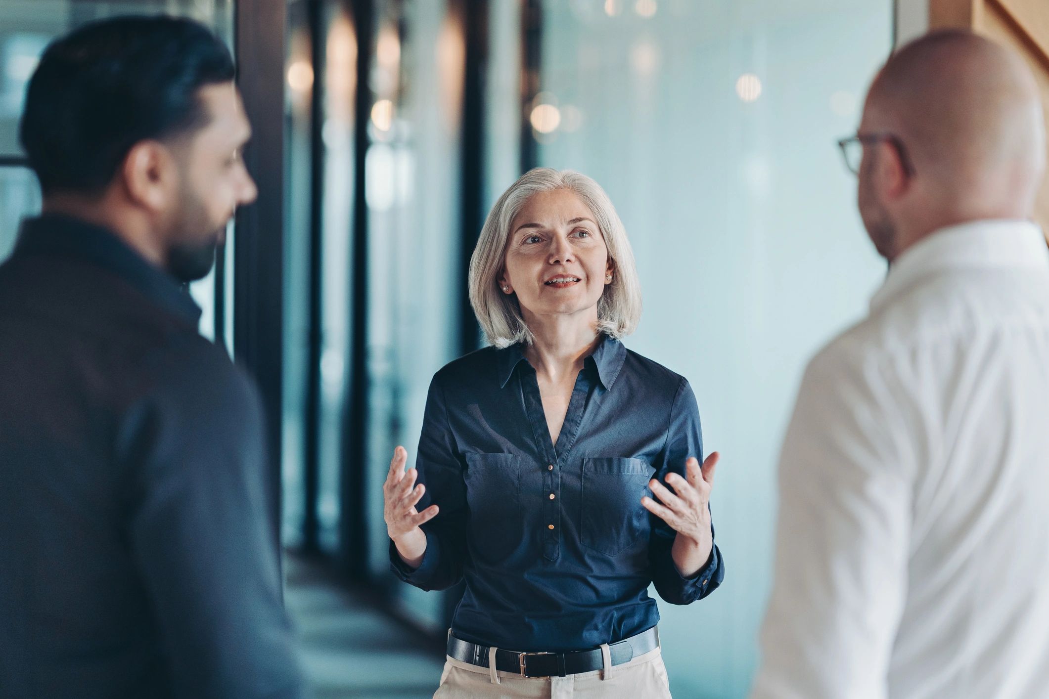Business advisor speaking with colleagues in an office